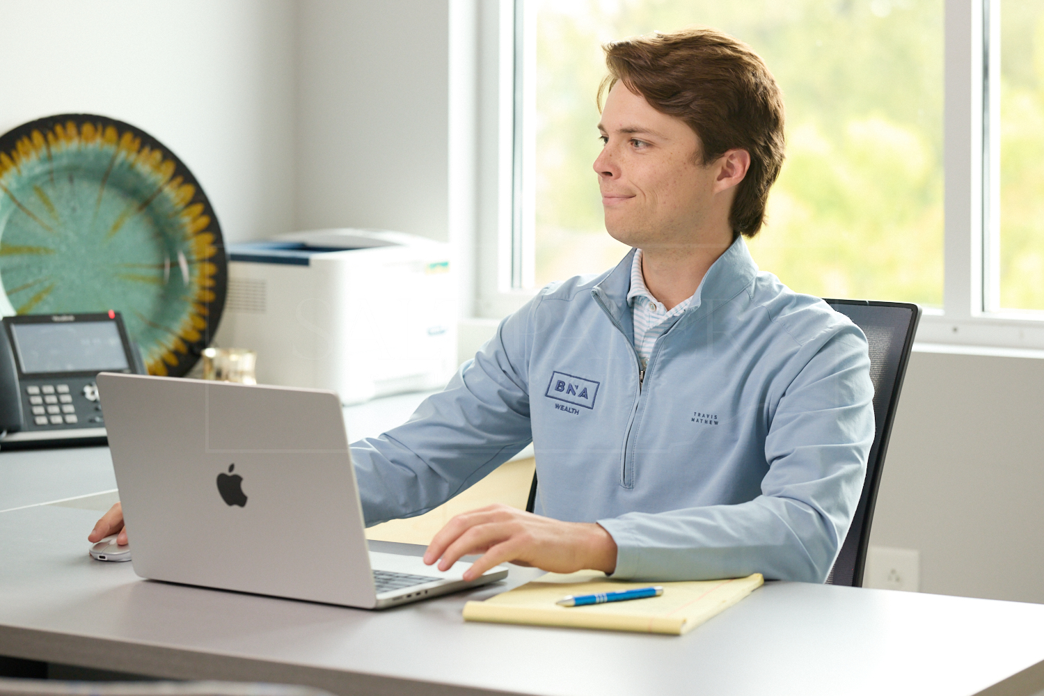 Gavin Gochnour, CFP®, focused at his desk while working as a Financial Advisor at BNA Wealth.